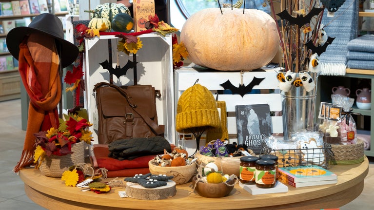 Table display of autumn themed goods in the shop at Ightham Mote, Kent